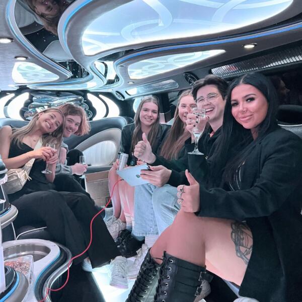 Group Celebrating In A Limousine